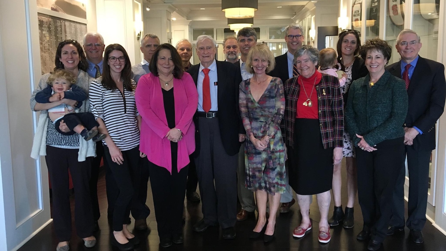 Carl Bumgardner, center with red tie, was joined by friends and family at a 2017 celebration of his new scholarship for chemistry students.
