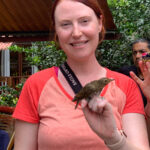 Jessica Chastain holding a bird during a study abroad trip to Ecuador.