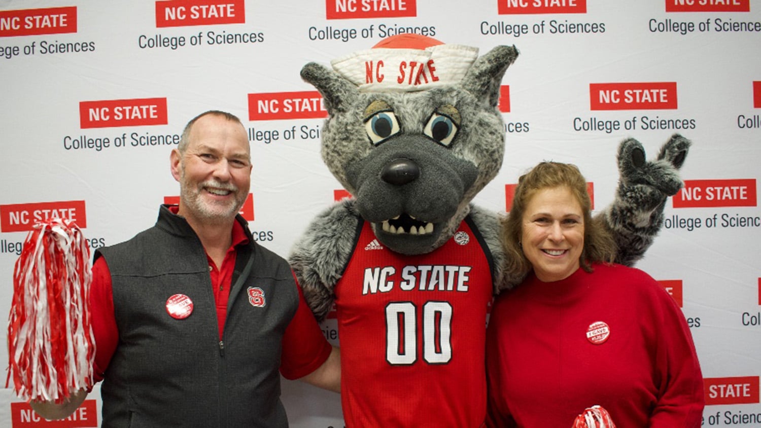 Dean and Gail Bunce with Mr. Wuf at a past Day of Giving event.