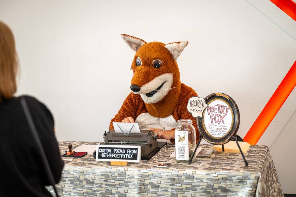 The Poetry Fox types out free, custom, impromptu poems for Pullen attendees on his typewriter, giving them a special way to commemorate the day.