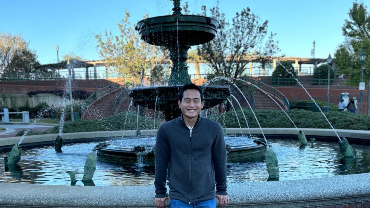 John Thomas “JT” Chappell in front of a water fountain.