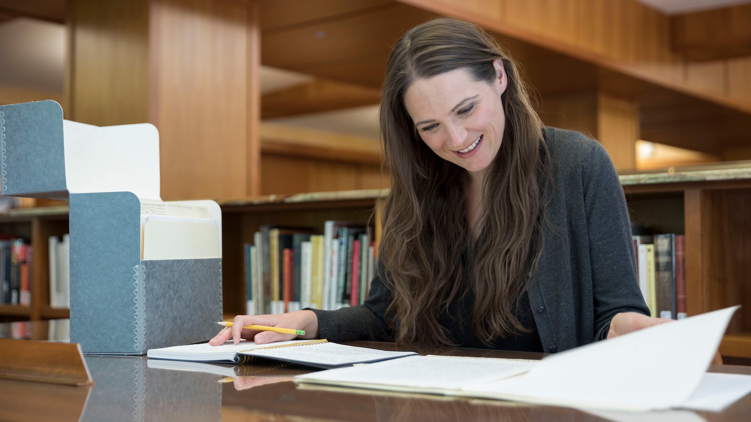 Philosophy professor Dr. Rachel Robison-Greene, the 2019 Tom Regan Visiting Research Fellow, working at a table in D.H. Hill Jr. Library.