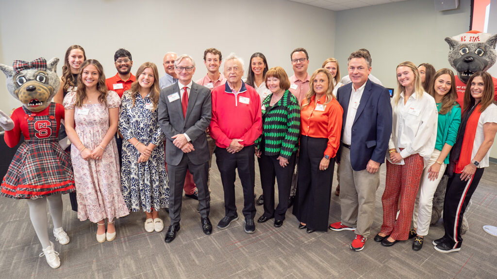 The Wilson family poses with scholarship students and the Wufs